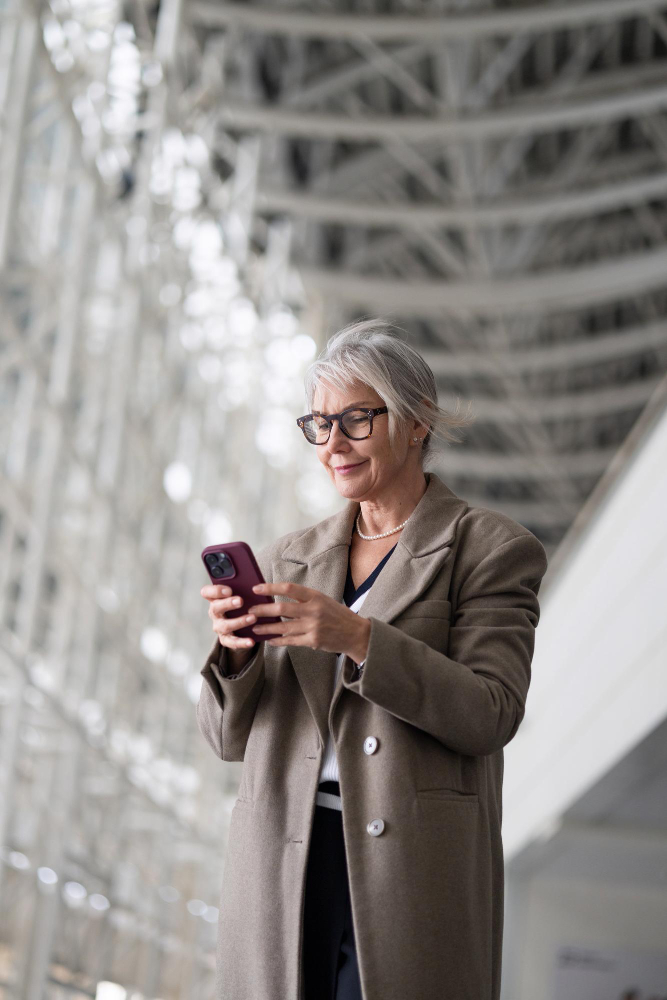 Professional staying connected with Roamvy business eSIM solution while traveling internationally